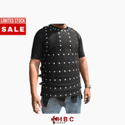 A man wearing a black protective vest with white circular studs or reflective dots, paired with a black t-shirt and blue jeans, shown against a plain white background with a red 'LIMITED STOCK SALE' banner on the top left and an 'HBC ARMOR' logo at the bottom.