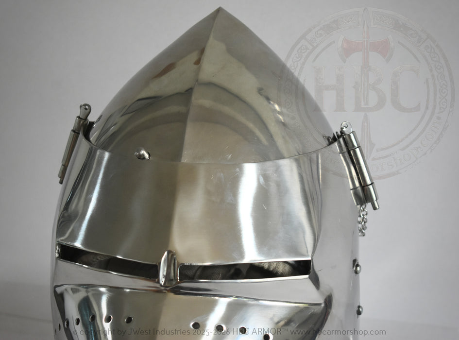 A polished steel medieval knight helmet with a pointed conical crown, visor, and side guards, shown against a light gray background with a faint HBC watermark.