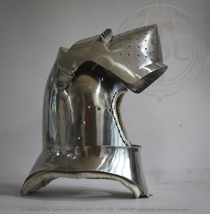 A polished steel medieval knight helmet with a visor, photographed against a neutral gray background with a faint watermark.