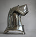 A polished steel medieval knight helmet with a visor, photographed against a neutral gray background with a faint watermark.