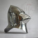 A polished steel medieval knight helmet with a pointed visor and curved neck guard, photographed against a light gray background with a faint HBC Armor watermark.