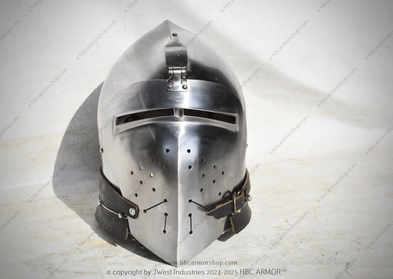A hand-forged 14th century Klappvisor Bascinet garlic head helmet with an openable visor, featuring a buff polished finish and quadrangular sight holes.