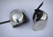 Two medieval-style steel helmet visors with black leather straps, displayed on a light gray background. One visor is shown closed and the other is shown open to display the internal structure and spike.