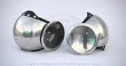 Two polished steel glomerin armor helmets with black leather straps and rivets, displayed side-by-side on a white background.
