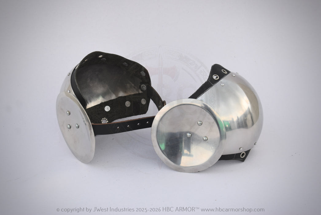 A pair of medieval-style steel gorgets with black leather straps, displayed on a light gray background.