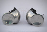 A pair of vintage-style metal arm guards with circular silver steel plates and black adjustable straps, displayed on a light gray background.