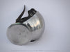 A polished steel medieval-style helmet with a round face shield and black leather chin strap, photographed on a light gray background.