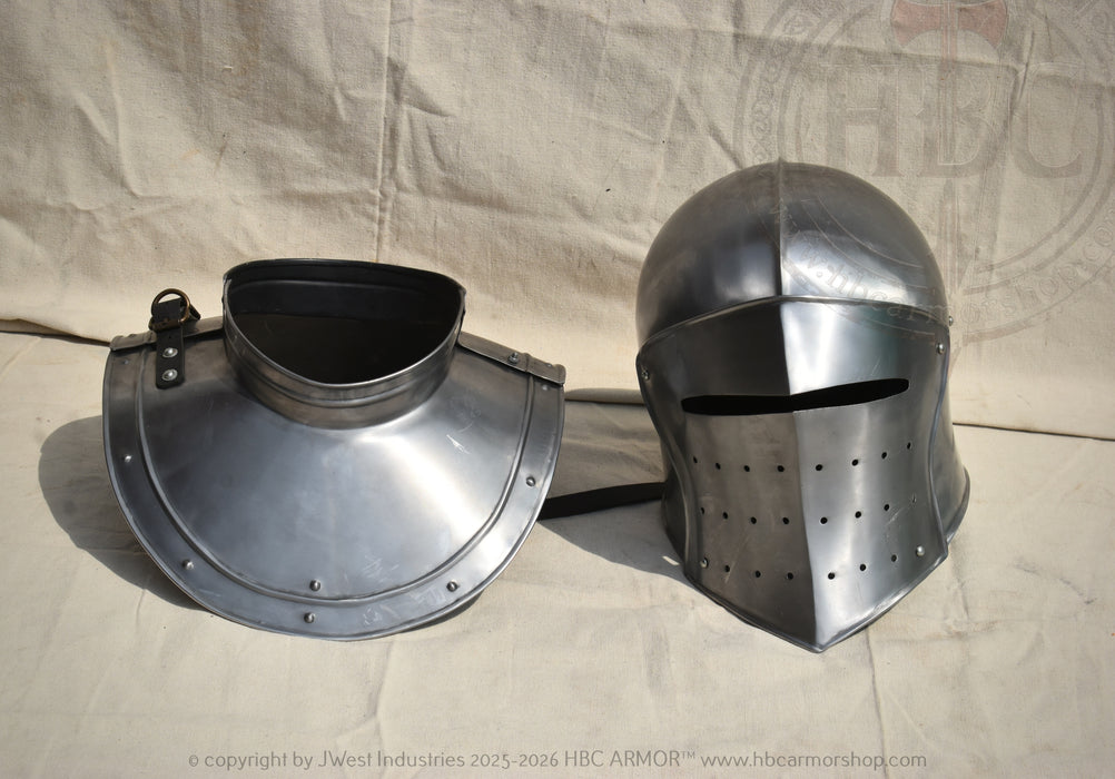 A medieval-style steel helmet and matching neck guard displayed side by side on a beige fabric backdrop.