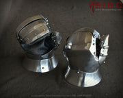 A pair of metal mitten armor designed for Buhurt medieval fighting, featuring a moveable thumb and padded leather for protection.
